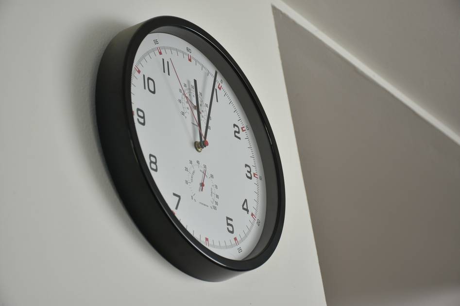 Close-up of elegant smart clock face in modern interior