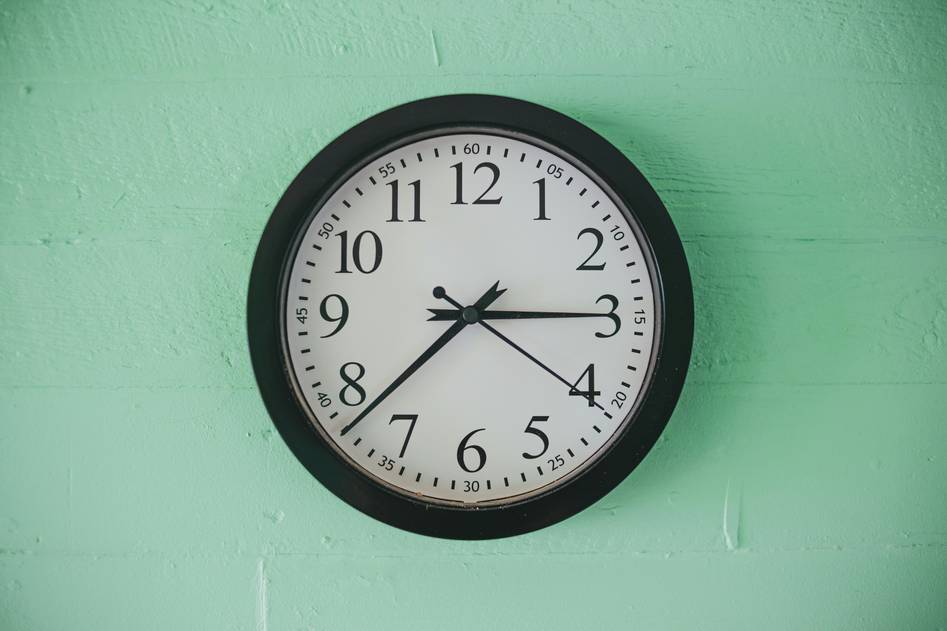Smart clock styled on bedside table with soft lighting